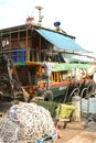 Fisherman repairs his boat in the harbor,Hongkong