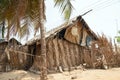 Fisher`s hut made of palm tree leaves in a Ghanaian village by the ocean Royalty Free Stock Photo