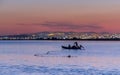 Fisher in Small Boat at Sunset in Tunisia, North Africa Royalty Free Stock Photo