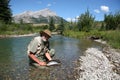 Fisher with trout Royalty Free Stock Photo