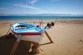 Fisherboat before tourist season at Kavos beach in Corfu, Greece