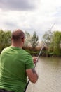 Fisherman in action, Fisherman holding rod in action Royalty Free Stock Photo