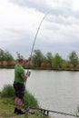 Fisherman in action, Fisherman holding rod in action Royalty Free Stock Photo