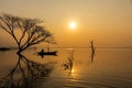 Fisherman action when fishing net on lake in the sunshine morning Royalty Free Stock Photo