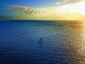 Aerial shot of an outrigger of the marshall islands in the pacific at sunset