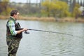 Fisherman angling on the river Royalty Free Stock Photo