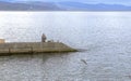 Fisherman on the beach in the autumn in the Crimea