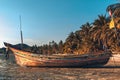 Fisherman boat on the beach at low tide at sunset Royalty Free Stock Photo