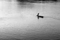 Fisherman in a boat, black and white