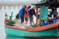 On the fisherman boat, Catching many fish