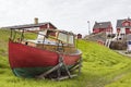 Fisherman boat in front of houses, Greenland