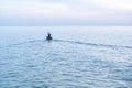 Fisherman on a boat heading out to the sea Royalty Free Stock Photo