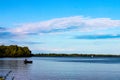 Fisherman in boat on lake with sailboat in the distance - Lake Erie Royalty Free Stock Photo
