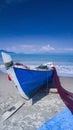 Fisherman Boat loads Fishing Net with Blue Sky and Cloudy Background Royalty Free Stock Photo