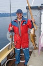 The fisherman on the boat near the island Skrova Royalty Free Stock Photo