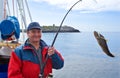 The fisherman on the boat in Norwegian fjord Royalty Free Stock Photo