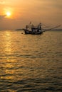 Fisherman boat on sea during sunset.