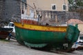 fisherman boat at shore drying fish Royalty Free Stock Photo