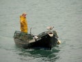 Fisherman on a boat silhouette