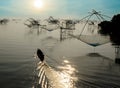 Fisherman Boat and Square Fish Net in Morning Sunrise at Songkla Lake Thailand Royalty Free Stock Photo