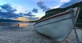 Fisherman boat at sunset in the lake Royalty Free Stock Photo