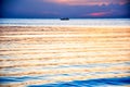 Fisherman on boat in twilight sky