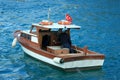 Fisherman on Bosporus River in blue waters