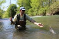 Fisherman with brown trout Royalty Free Stock Photo