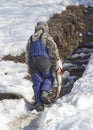 Fisherman carries fish