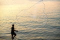 The fisherman cast a net the sea