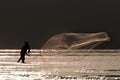 Fisherman casting fishing net