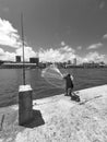 fisherman casting net to the sea in Parque das Esculturas in Recife,, Pernambuco, Brazil