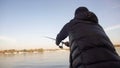 Fisherman casting spinning rod, tutorial for beginners, fishing gear, supplies Royalty Free Stock Photo