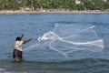 A fisherman casts his net into the sea at Arugam Bay on Sri Lanka's east coast.