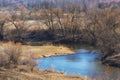 Fisherman catches fish on a rod on the river bank