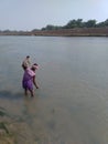 Fisherman catching fish in the river the kangsaboti in India