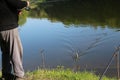 A fisherman caught a fish and hauls it ashore