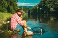 Fisherman caught a fish. Man fishing on river. Royalty Free Stock Photo