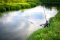 Fisherman caught fish on the river in the countryside. Royalty Free Stock Photo