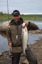 Fisherman caught large salmon in the north river.