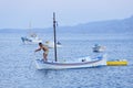 Fisherman checking anchor