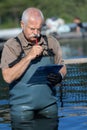 fisherman checking clipboard
