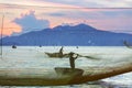 Fisherman checks his nets in early morning on river in Hoian, Vietnam Royalty Free Stock Photo