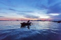 Fisherman checks his nets in early morning on river in Hoian, Vietnam Royalty Free Stock Photo