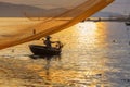 Fisherman checks his nets in early morning on river in Hoian, Vietnam Royalty Free Stock Photo