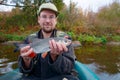 Fisherman with chub