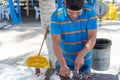 Fisherman cleaning fish in local market Royalty Free Stock Photo