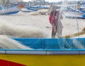 Fisherman cleaning nets