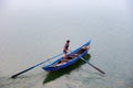 Fisherman come home in O Loan lagoon, Phu Yen, Vietnam Royalty Free Stock Photo