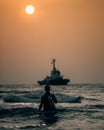 fisherman coming from sea before sunset.